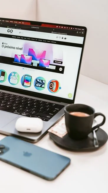 High-angle view of a stylish work desk featuring dual monitors, keyboard, mouse, and modern accessories.