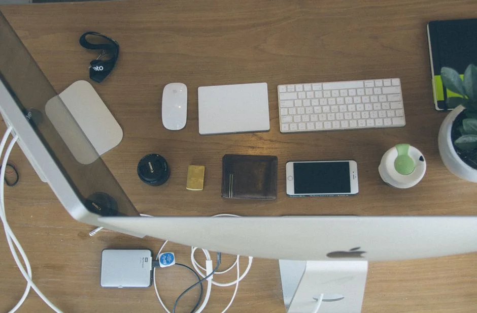A contemporary workspace showcasing a laptop, tablet, and smartphones, ideal for tech and freelance use.